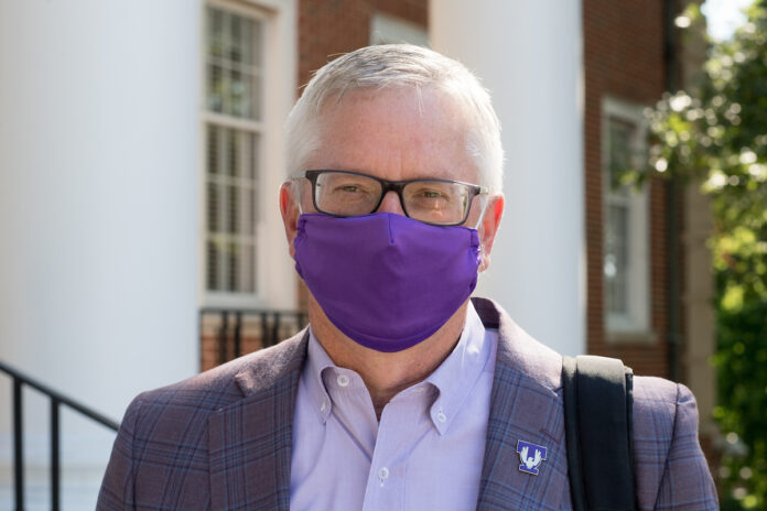 Portrait of President Phil Oldham wearing a face covering.